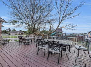 Wooden deck with a playground