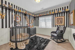 Sitting room with light hardwood / wood-style floors