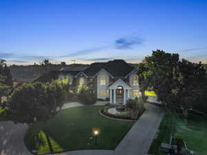 View of front of property with a yard