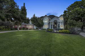 View of front of house featuring a lawn