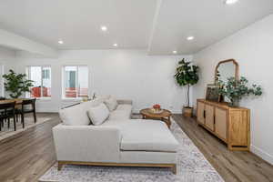 Living room with wood-type flooring