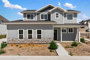 Craftsman-style home featuring a garage