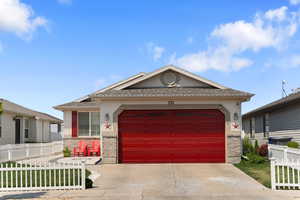 View of front of property featuring a garage