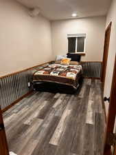 Bedroom featuring dark hardwood / wood-style flooring