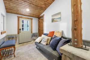 Interior space with lofted ceiling and wood ceiling