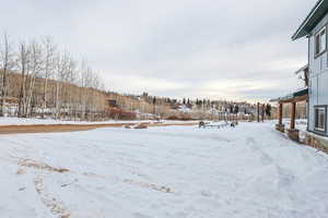 View of yard covered in snow