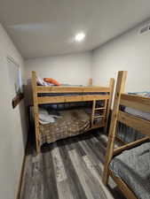 Bedroom featuring dark wood-type flooring