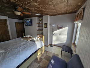 Bedroom featuring ceiling fan