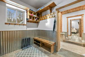 Mudroom with concrete flooring and radiator