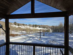 View of yard layered in snow