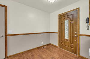 Entryway featuring hardwood / wood-style flooring