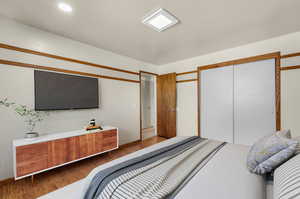 Bedroom with wood-type flooring