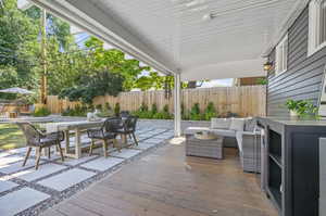 Wooden terrace with an outdoor hangout area