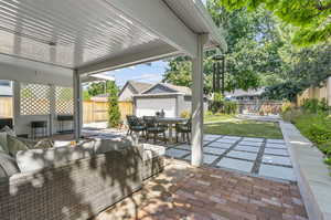 View of patio / terrace with an outbuilding and an outdoor hangout area