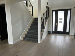 Foyer entrance featuring hardwood / wood-style flooring