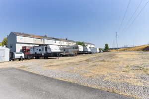 View of front of property featuring a storage unit