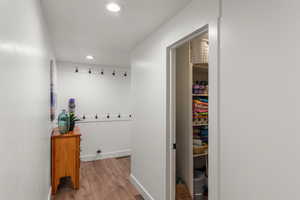 Corridor featuring light hardwood / wood-style flooring