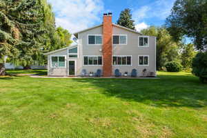 Front door, patio, featuring a lawn