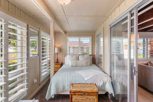 Bedroom with wood walls