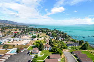 Birds eye view of property with a water view