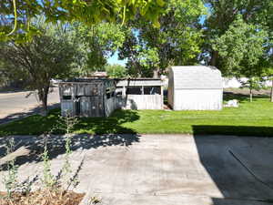 View of yard featuring a storage sheds