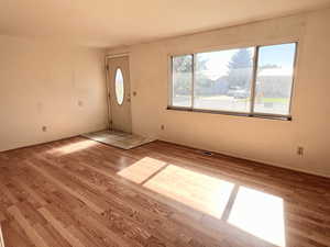 Empty room with light LVP / wood-style flooring