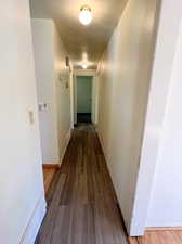 Hall featuring LVP wood-type flooring