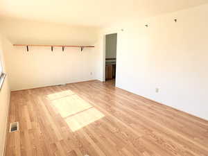 Unfurnished room featuring light LVP / wood-style floors