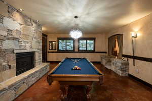 Lower level family room with pool table (included) and gas fireplace.