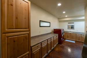 Lower level large laundry room.