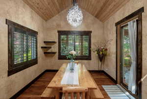 Dining room off kitchen with wood ceiling.