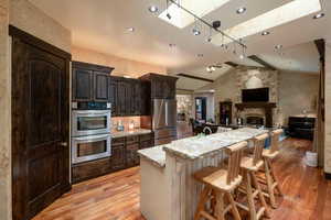 Dark walnut stained cabinets in kitchen