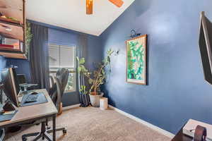 Office with custom wood shelves. Can also be a bedroom.