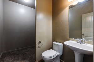 Bathroom featuring toilet and tile patterned floors