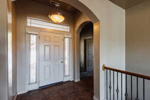 Foyer featuring dark tile patterned floors