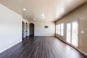 Interior space featuring dark wood-type flooring