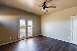 Unfurnished room with a textured ceiling, ceiling fan, and hardwood / wood-style floors