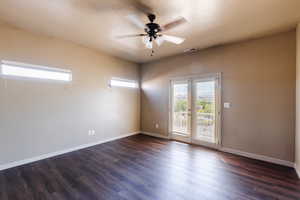 Spare room featuring hardwood / wood-style flooring, a textured ceiling, and ceiling fan