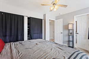 Carpeted bedroom with ceiling fan