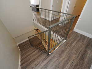 Stairway with hardwood / wood-style flooring