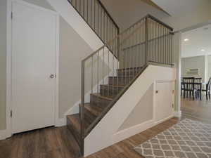 Stairs with hardwood / wood-style floors