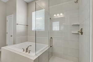 Bathroom with shower with separate bathtub