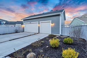 View of garage at dusk