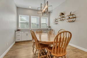 Dining room featuring a chandelier and light hardwood / wood-style floors