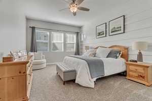 Bedroom with light carpet and ceiling fan