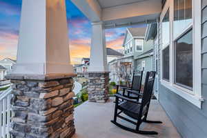 Patio terrace at dusk with covered porch