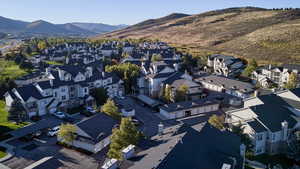 View of property location featuring mountains and nearby suburban area
