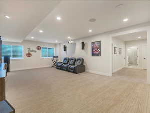 Living room featuring light carpet