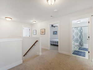 Hallway with light carpet