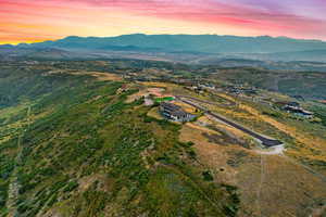 Aerial view at dusk featuring a mountain view